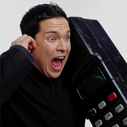 Dom Joly on his giant analogue phone in Trigger Happy TV